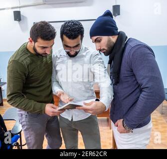Arabic students discussing things in class Stock Photo