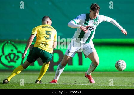 GRONINGEN, NETHERLANDS - FEBRUARY 28: Roel Janssen of Fortuna Sittard, Jorgen Strand Larsen of FC Groningen during the Dutch Eredivise match between F Stock Photo