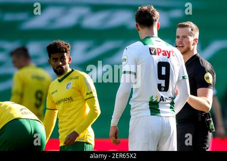 GRONINGEN, NETHERLANDS - FEBRUARY 28: Jorgen Strand Larsen of FC Groningen, Referee Jannick van der Laan during the Dutch Eredivise match between FC G Stock Photo