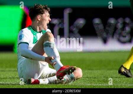 GRONINGEN, NETHERLANDS - FEBRUARY 28: Jorgen Strand Larsen of FC Groningen injured during the Dutch Eredivise match between FC Groningen and Fortuna S Stock Photo