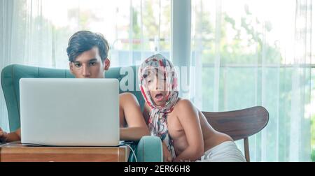 Arabic boy playing on laptop Stock Photo