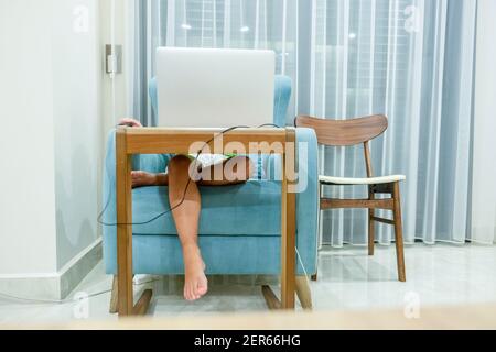 Arabic boy playing on laptop Stock Photo