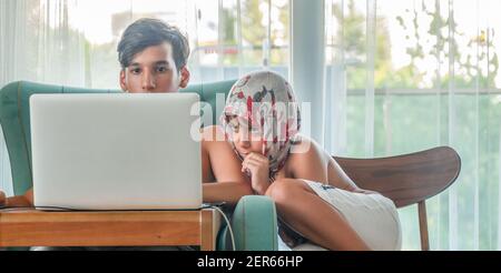 Arabic boy playing on laptop Stock Photo