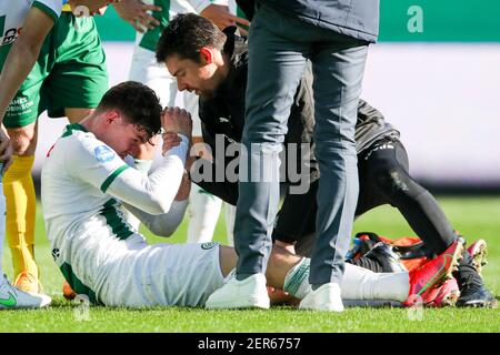 GRONINGEN, NETHERLANDS - FEBRUARY 28: Jorgen Strand Larsen of FC Groningen injured during the Dutch Eredivise match between FC Groningen and Fortuna S Stock Photo