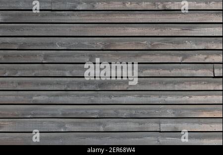 Painted wooden cladding on the side of a building. Background texture. UK Stock Photo