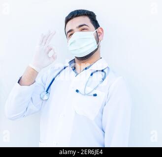 Arabic doctor doing the admiration symbol Stock Photo