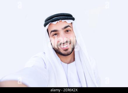 Arabic guy taking selfie and smiling Stock Photo