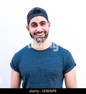 Portrait of happy guy smiling wearing a hat Stock Photo
