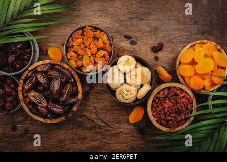 Healthy food snack: dried fruits, natural sun dried organic mix of dried apricots, figs, raisins, dates, cranberries, cherries, goji berries, prunes i Stock Photo