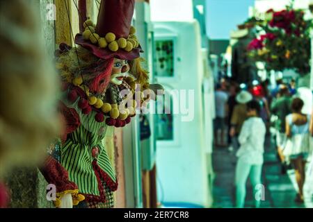 Santorini, Greece - September 11, 2017: A toy joker kept as a decorative item in front of a shop in the commercial street of famous greek island for t Stock Photo