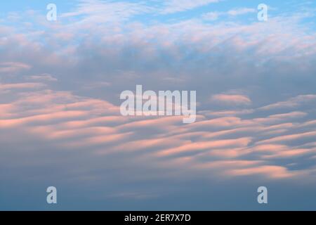 Soft pastel colors of an interesting cloud formation at sunset Stock Photo