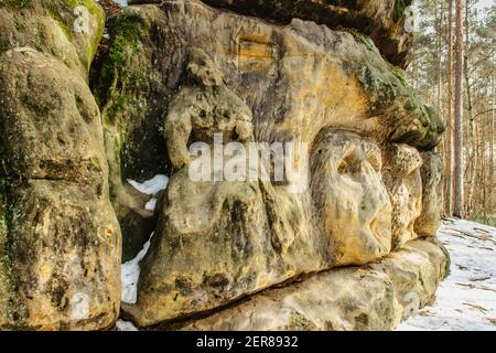 Harfenice Natural Formations are large sandstone blocks of sculptures carved into sandstones.Monumental giant heads and other artworks in pine forest Stock Photo