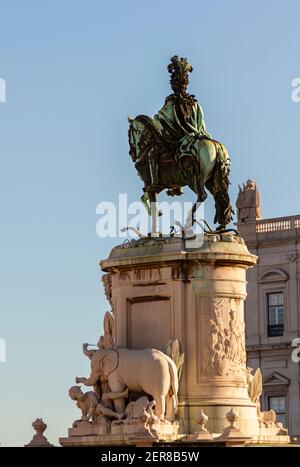 From behind view of Statue of King Jose I of Portugal on a horse crushing the snakes on his path. Bronze statue was built by Machado de Castro in 1775 Stock Photo