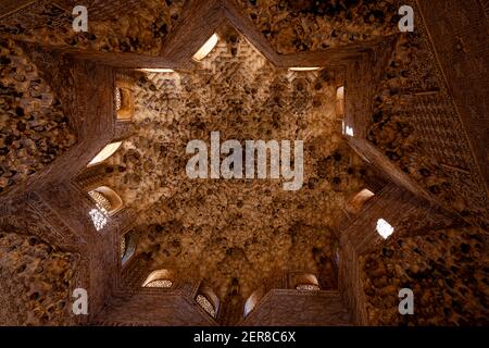 07-13-2010 Granada, Spain: Octagonal 8 point star shaped ceiling with arched dormer windows on the ceiling of the dome of Nasrid palace in the Alhambr Stock Photo