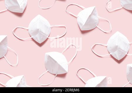 Protectiva face masks pattern on pink background Stock Photo