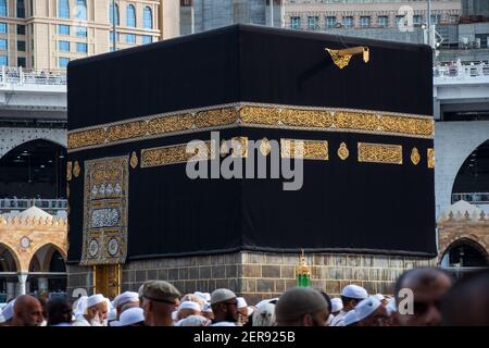 Holy Kaaba close up view. Muslim pilgrims around Kaaba. Saudi Arabia - Mecca Stock Photo