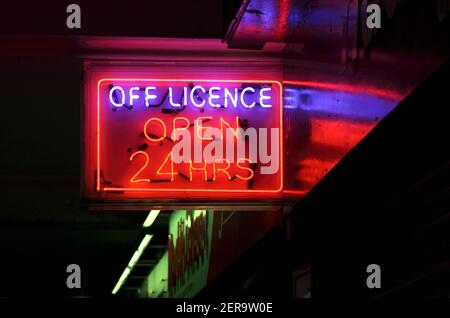 Sign advertising off licence 'open 24 hours', Brighton city centre. Stock Photo