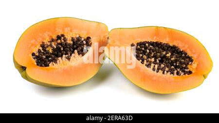 Exotic fruit papaya cut in half on white background Stock Photo