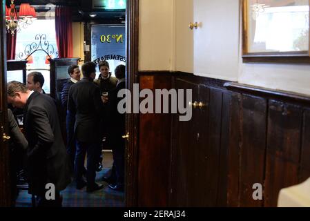Men drinking at The Guinea pub, Mayfair, London Stock Photo