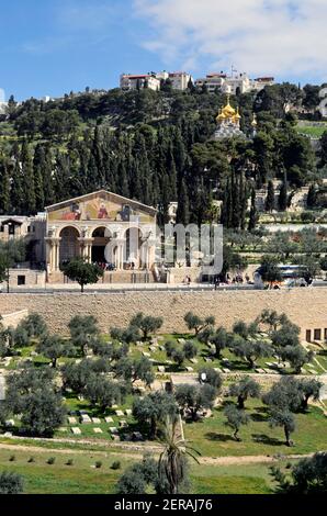 view over green Kidron Valley in spring to the Mount of Olives with Garden of Gethsemane and the Church of All Nations and Church of St Mary Magdalene Stock Photo