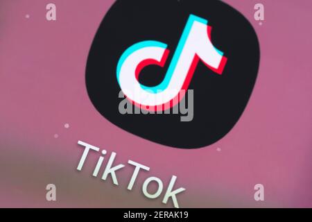 A macro closeup of the TikTok app logo on a smartphone screen. TikTok, known in China as Douyin, is a video-sharing social networking service Stock Photo
