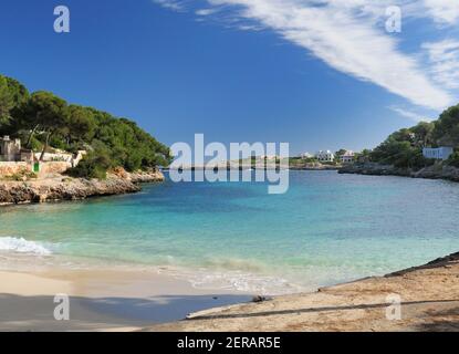 Turquoise Water On The Sand Beach In The Bay Of Cala Gran On Balearic Island Mallorca On A Sunny Winter Day With A Clear Blue Sky Stock Photo