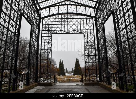 vintage iron trellis park entry gate Stock Photo