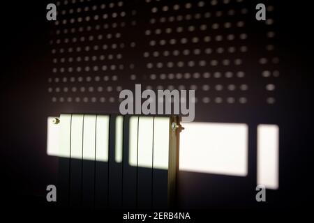 Shadows on a wall created by the morning sunlight coming through a shutter. Barcelona. Catalonia. Spain. Stock Photo