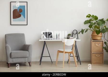 Background image of minimal interior with home office workplace, copy space Stock Photo