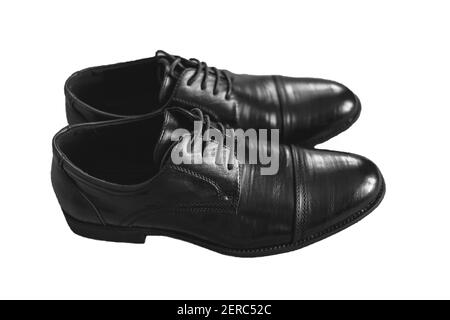 Men's black shoes stand on a white isolated background. Stock Photo