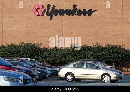 A logo sign outside of a Younkers retail department store in Omaha ...