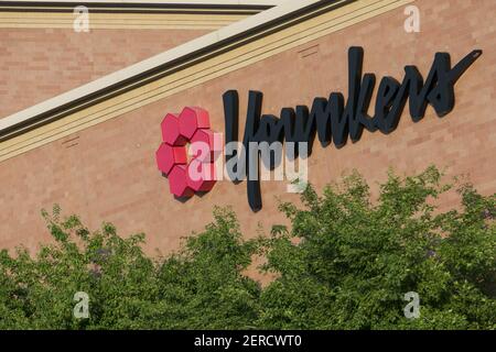 A logo sign outside of a Younkers retail department store in Omaha ...