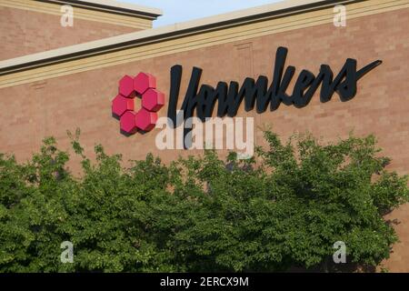 A logo sign outside of a Younkers retail department store in Omaha ...