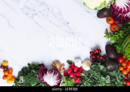 Prodcue on white marble background with room for text Stock Photo