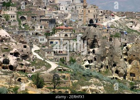 Special stone formation and houses near the Uchisar Castle in Cappadocia, Nevsehir, Turkey. Cappadocia is part of the UNESCO World Heritage Site. Stock Photo