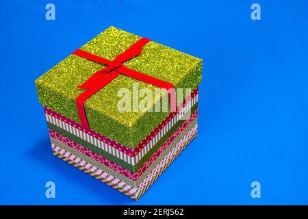 Colorful Christmas Gift Box On Blue Background Stock Photo