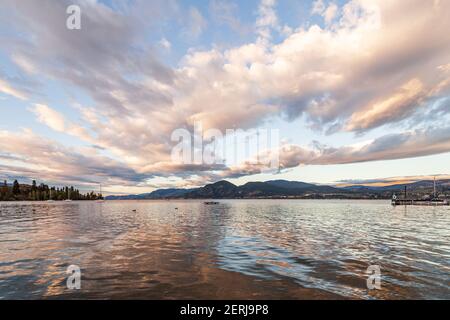 beautiful calm lake in British Columbia Canada early morning clouds on sky Stock Photo