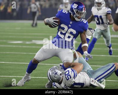 New York Giants cornerback Donte' Deayon (38) and Dallas Cowboys linebacker  Leighton Vander Esch (55) talk after the game on Sunday, Sept. 16, 2018, at  AT&T Stadium in Arlington, Texas. (Photo by