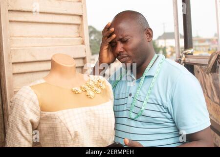 a man puts his hand on his forehead looking dissapointed Stock Photo