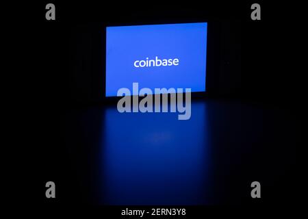 Coinbase logo is seen on a smartphone. Coinbase is a US digital currency exchange built on financial technology and based in San Francisco, California. Stock Photo