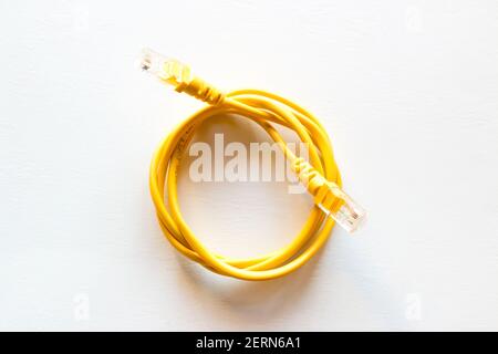 yellow lan internet cable on white background Stock Photo