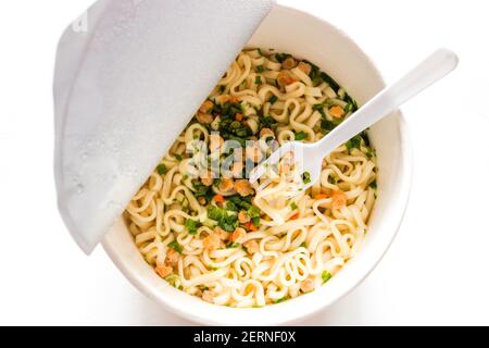 instant noodles with plastic fork isolated on white background Stock Photo