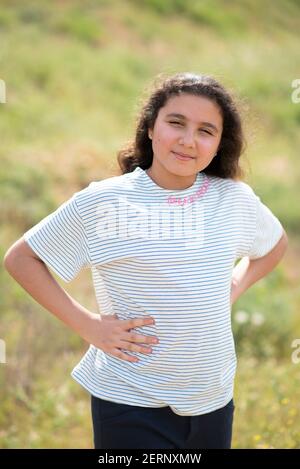 Beautiful 12 years old middle eastern girl in nature Stock Photo