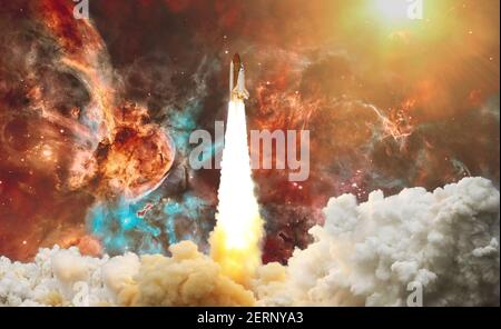 Rocket launch. Rocket with smoke flies into space. Space Shuttle .Spaceship begins the mission. Elements of this image furnished by NASA Stock Photo