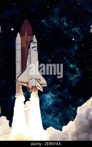 Rocket launch. Rocket with smoke flies into space. Space Shuttle .Spaceship begins the mission. Elements of this image furnished by NASA Stock Photo