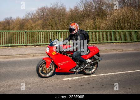 1995 90s red Ducati red 900 Ss; Supersport superbike Motorbike rider; two-wheeled transport, motorcycles, Candolini vehicle, roads, motorbikes, motorcycle bike riders motoring in Chorley, UK Stock Photo