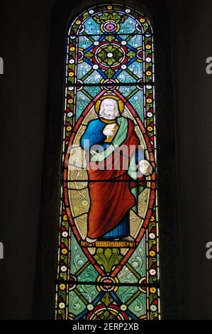 Victorian stained glass window depicting Saint Barnabas, who is the patron saint of Cyprus. Window created in the mid 19th century for the church of S Stock Photo