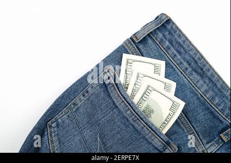 Dollar bills in the back pocket of jeans Stock Photo