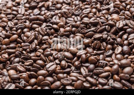 Roasted dark espresso coffee beans, full frame wallpaper background, close-up, flat lay view from above, still life, I love coffee concept Stock Photo