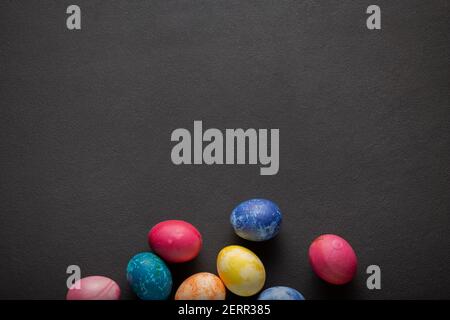 Easter eggs against dark background with copy space Stock Photo